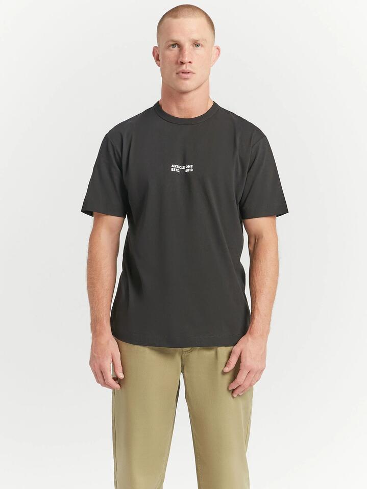Image of a model wearing Tops. Productname: Article One Studio Logo 2.0 T-Shirt in Black colour by brand - Article One