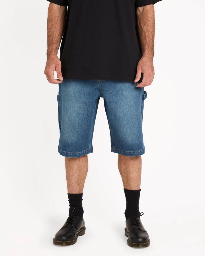 Image of a model wearing Shorts. Productname: volcom - Mens Kraftsman Ii Carpenter Shorts - Park Blue - in Park Blue colour by brand - volcom