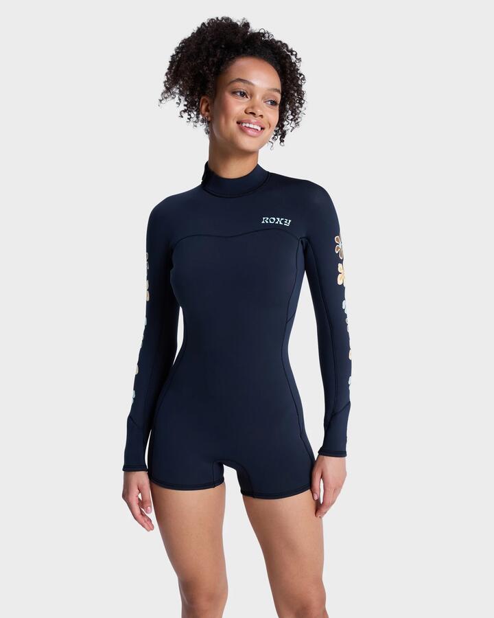 Image of a model wearing Tops. Product name - Roxy Womens 2Mm Swell Back Zip Natural Long Sleeve Springsuit Flower in Flower colour by brand - Roxy