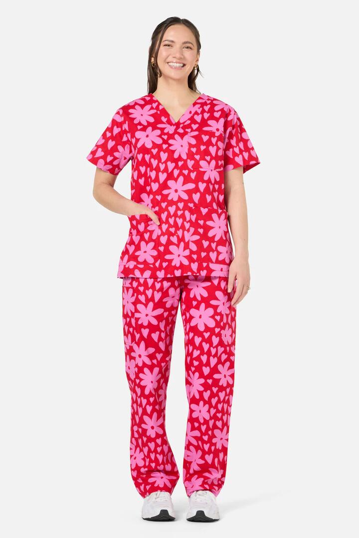 Image of a model wearing Uniforms & Workwear. Product name - Valentina Scrub Set in Red colour by brand - Scrubs With Love