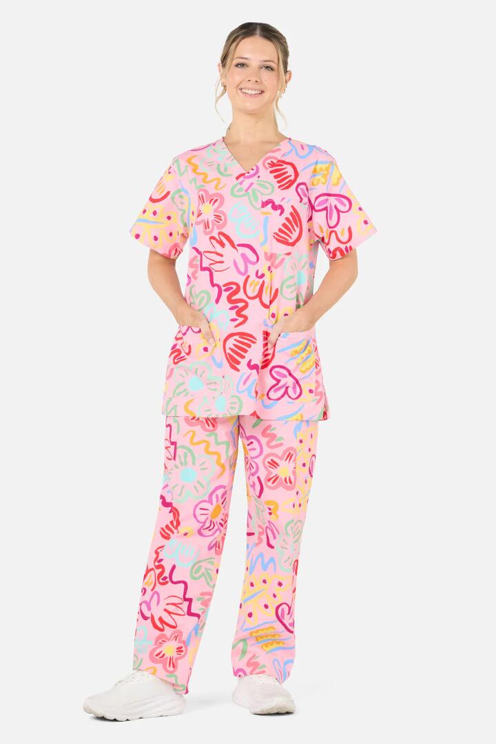 Image of a model wearing Uniforms & Workwear. Product name - Holiday scrub set in Pink colour by brand - Gorman