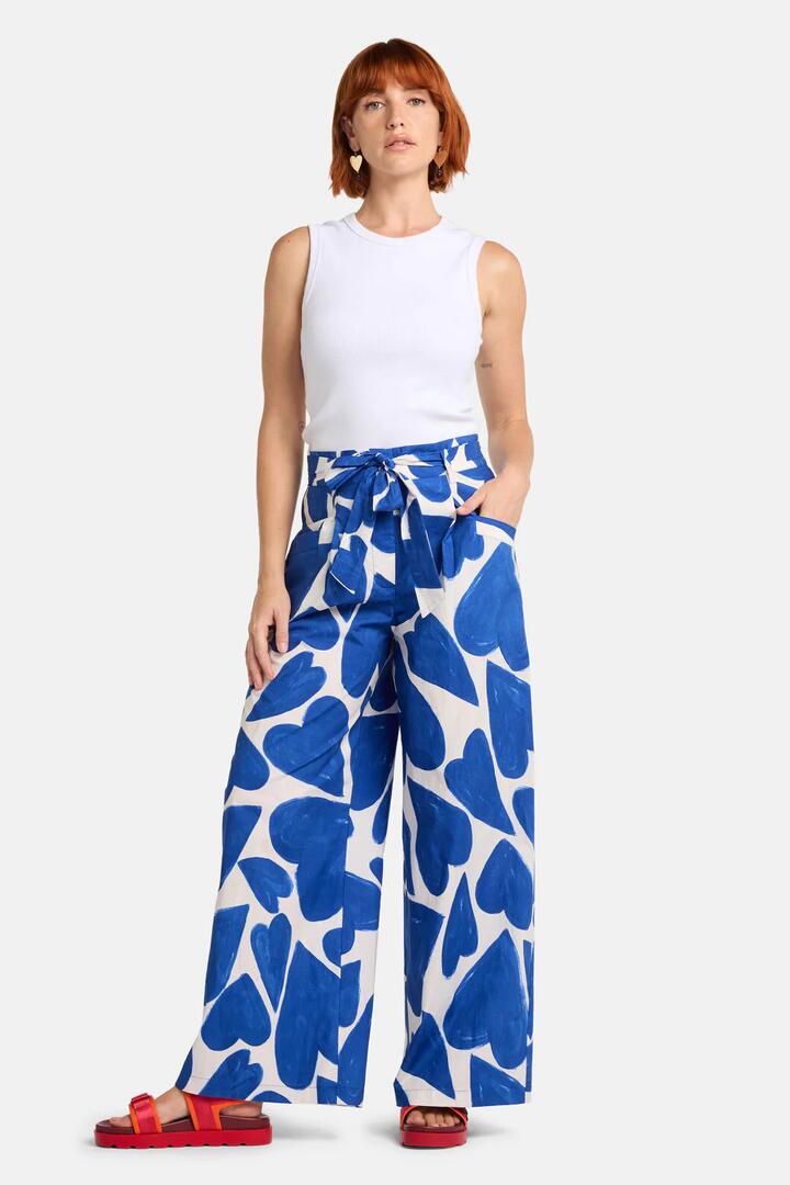 Image of a model wearing Pants. Product name - Heartbeat Print Wide Pant in Blue colour by brand - Gorman