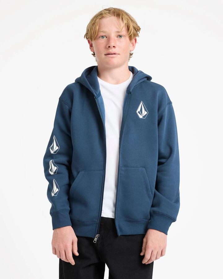 Image of a model wearing Outerwear. Product name - Volcom Boys 8-16 Iconic Stone Zip Up Hoodie Dust Bowl Indigo in Dust Bowl Indigo colour by brand - Volcom