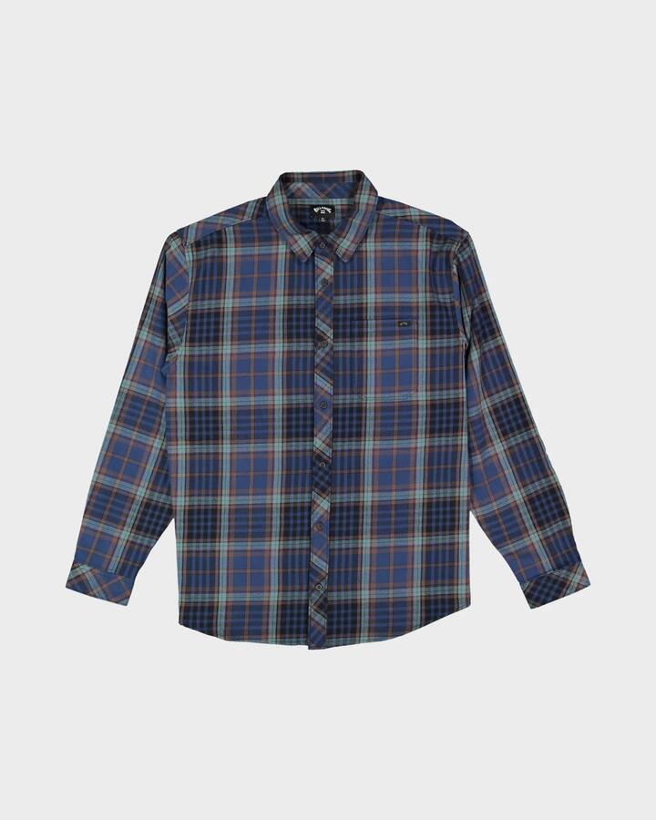 Image of a model wearing Tops. Productname: billabong Mens Coastline Long Sleeve Flannel Shirt Dark Denim - in Dark Denim colour by brand - Billabong