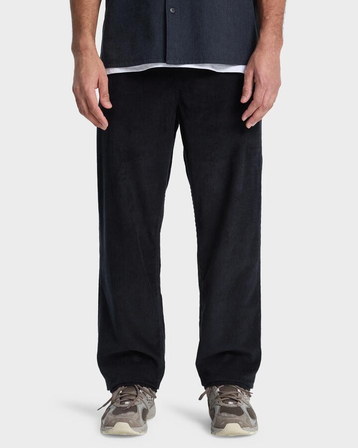 Image of a model wearing Pants. Product name - Quiksilver Mens Taxer Cord Pants Black in Black colour by brand - Quiksilver