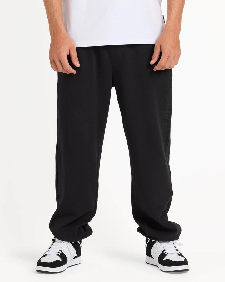 Image of a model wearing Pants. Product name - Quiksilver Mens Graphic Track Pants Black in Black colour by brand - Quiksilver