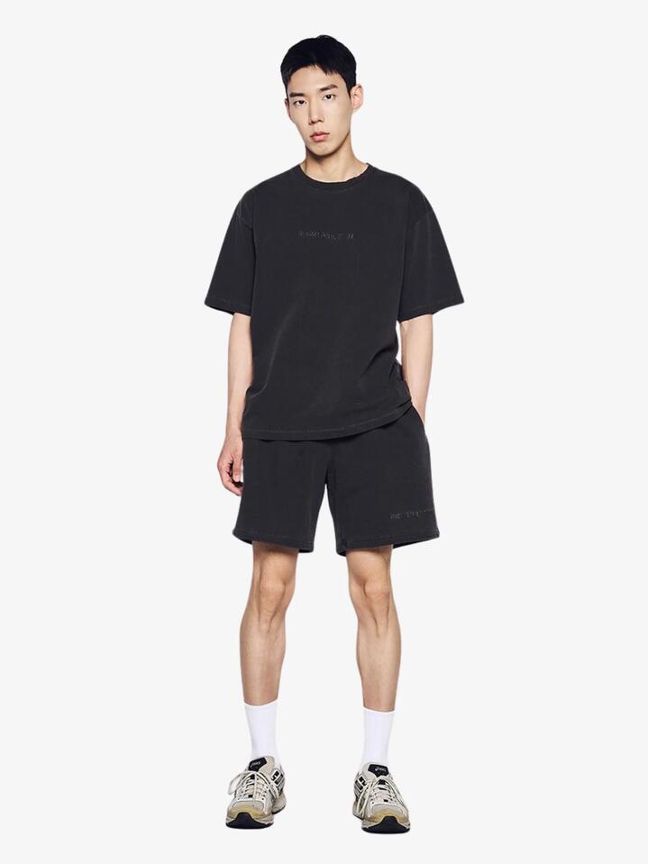 Image of a model wearing Shorts. Productname: ADLV Simple Logo Pigment Short Sleeve T-Shirt in Charcoal colour by brand - ADLV