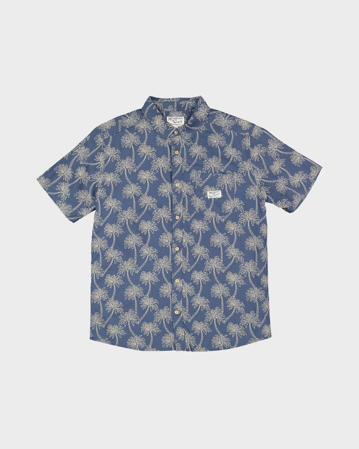 Image of a model wearing Shorts. Product name - RVCA Mens Exotica Shorts Sleeve Shirt Dark Denim in Dark Denim colour by brand - RVCA