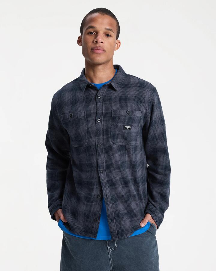 Image of a model wearing Tops. Product name - Quiksilver Mens Shady Times Long Sleeve Shirt Shady Times Black in Shady Times Black colour by brand - Quiksilver