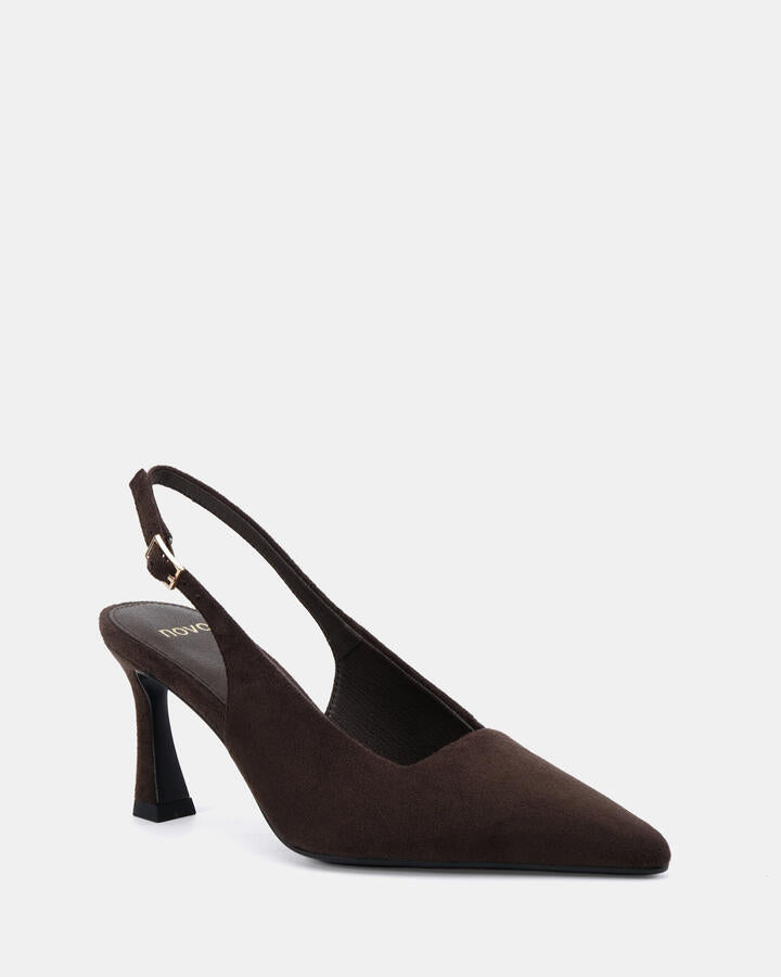 Image of a model wearing Pants. Product name - Iylah Espresso Suede Pumps in Espresso Suede colour by brand - Novo