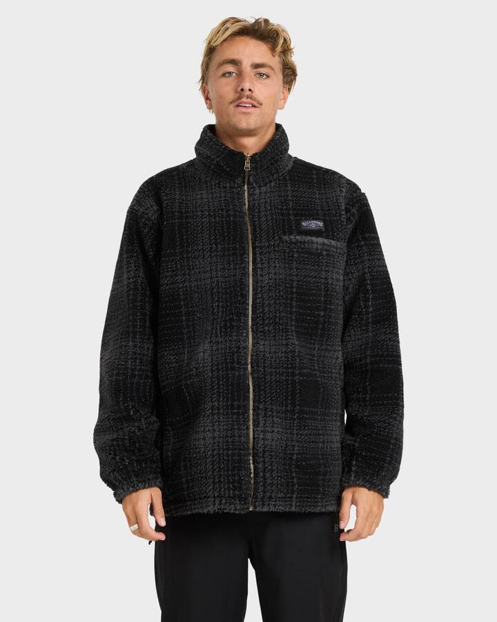 Image of a model wearing Outerwear. Product name - Billabong Mens Gnaraloo Reversible Mock Neck Fleece Top Black in Black colour by brand - Billabong