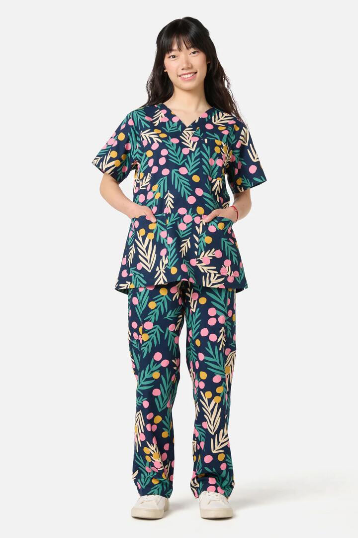 Image of a model wearing Uniforms & Workwear. Product name - Bernadette scrub set in Navy colour by brand - Scrubs With Love