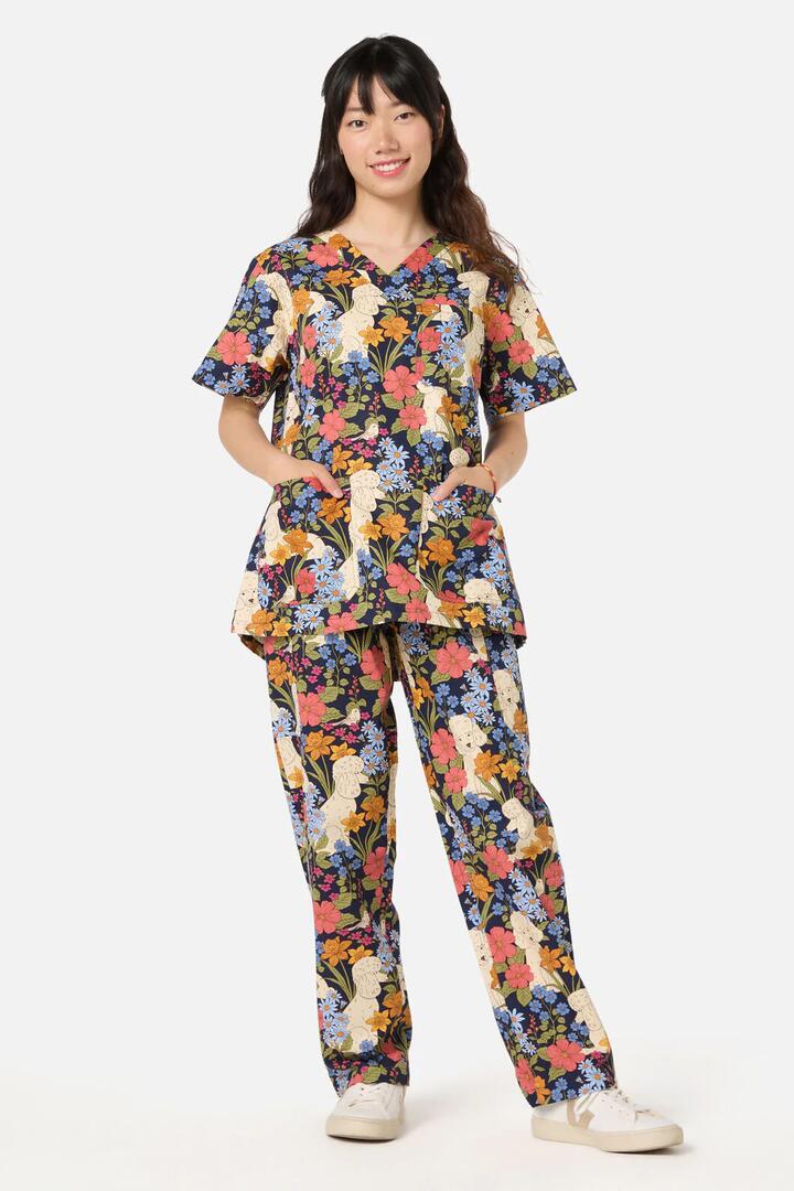 Image of a model wearing Uniforms & Workwear. Product name - Poodle scrub set in Navy colour by brand - Scrubs With Love