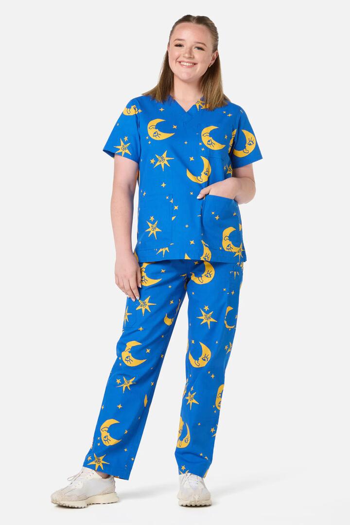 Image of a model wearing Uniforms & Workwear. Product name - Nocturne scrub set in Navy colour by brand - Scrubs With Love