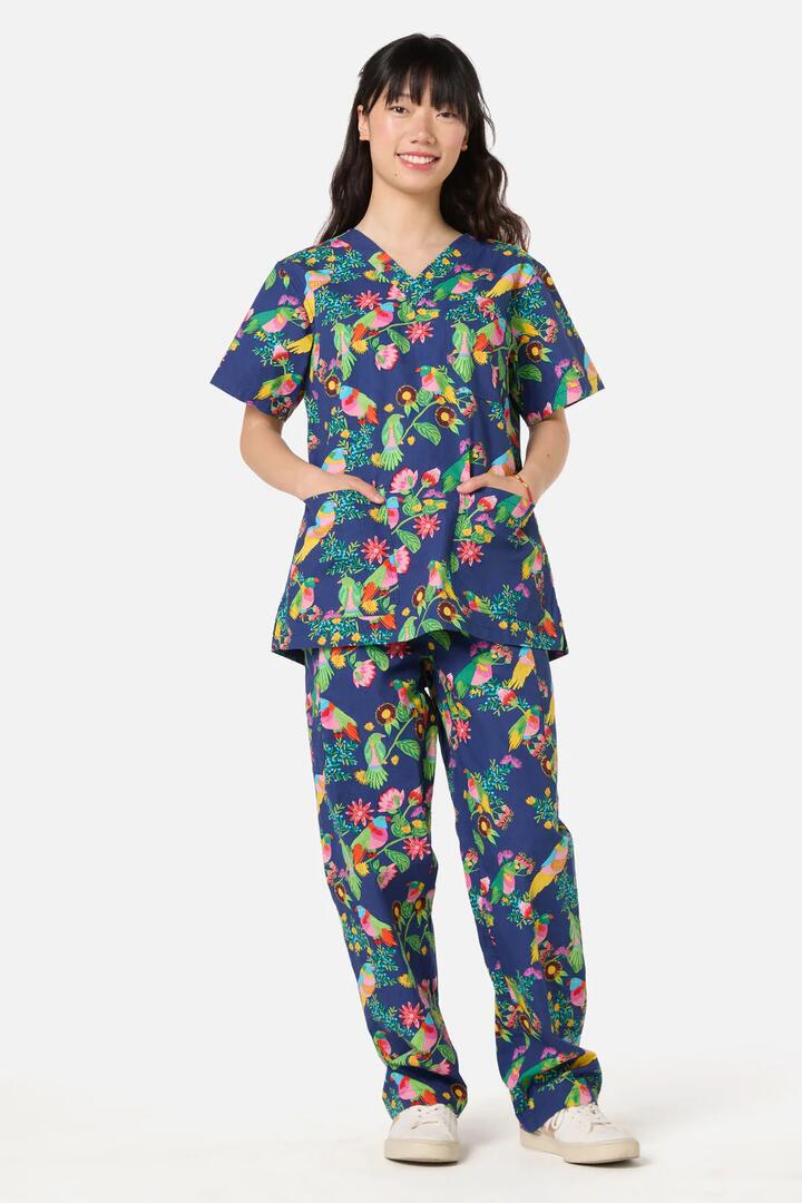 Image of a model wearing Uniforms & Workwear. Product name - Party Parrots scrub set in Navy colour by brand - Gorman