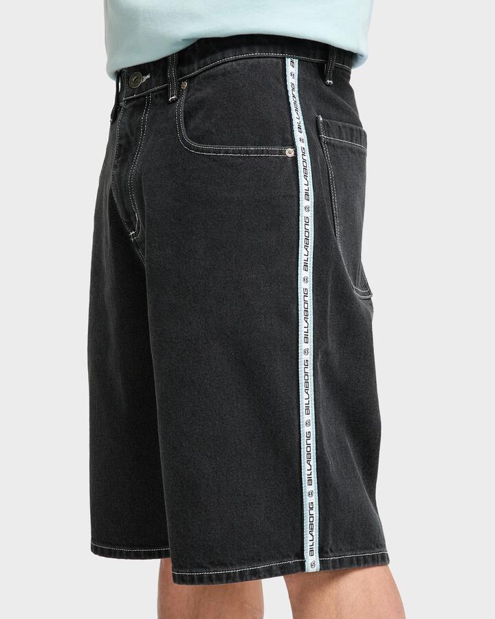 Image of a model wearing Shorts. Productname: billabong Mens Spec 73 Signals Baggy Fit Denim Shorts Washed Black - in Washed Black colour by brand - Billabong