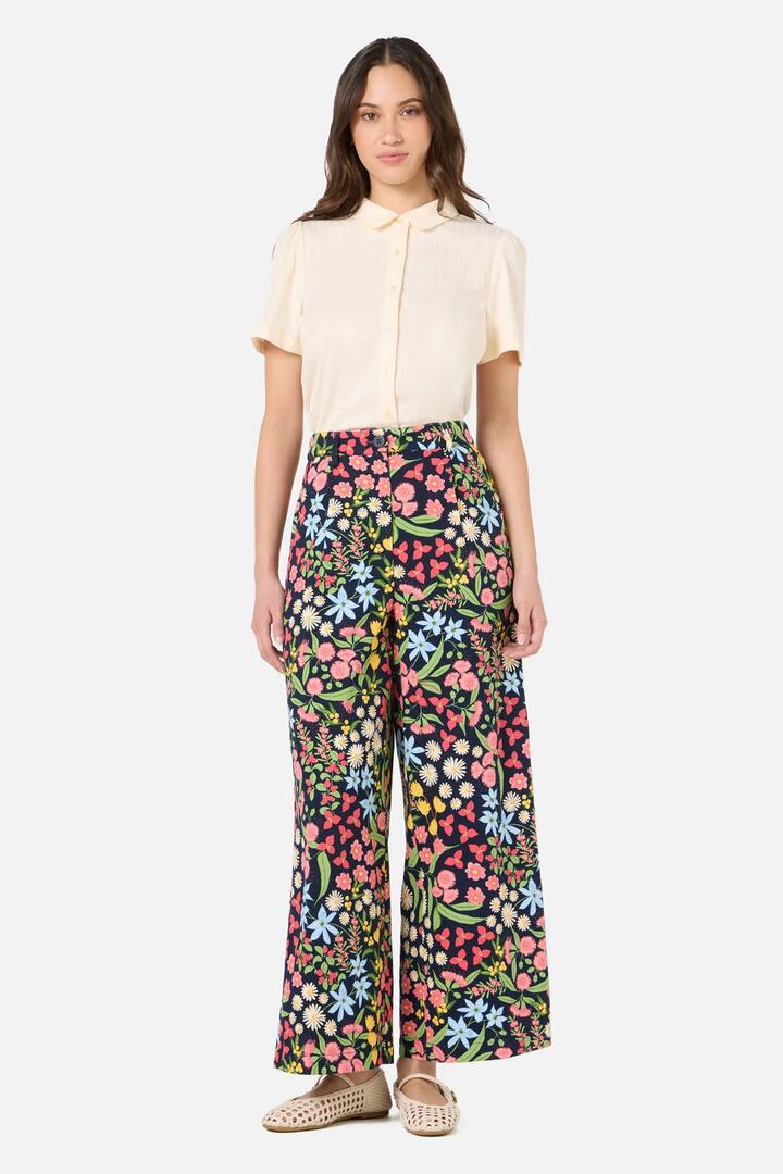 Image of a model wearing Pants. Productname: Liberty Native Wide Leg Pant in Navy colour by brand - Princess Highway