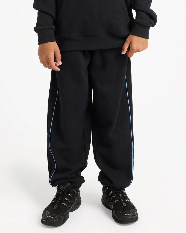 Image of a model wearing Pants. Product name - Quiksilver Boys 8-16 Panelled Track Pants Black in Black colour by brand - Quiksilver
