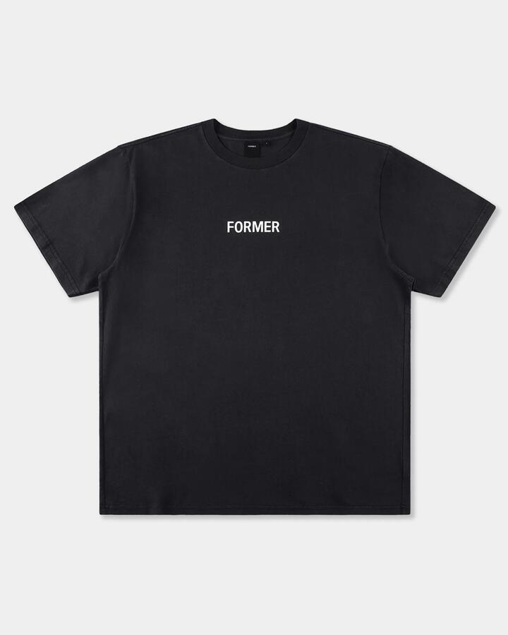 Image of a model wearing Tops. Productname: former Mens Legacy Overdye T-Shirt Washed Black - in Washed Black colour by brand - Former