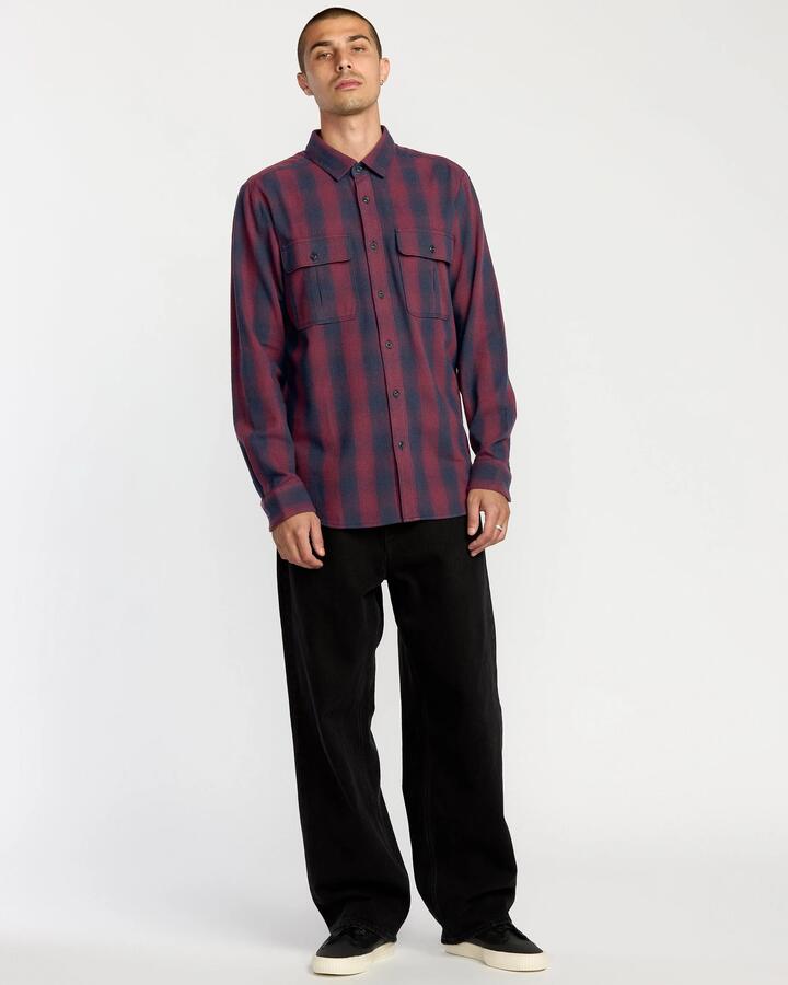 Image of a model wearing Tops. Product name - Volcom Mens Shadowstone Flannel Long Sleeve Shirt Navy in Navy colour by brand - Volcom