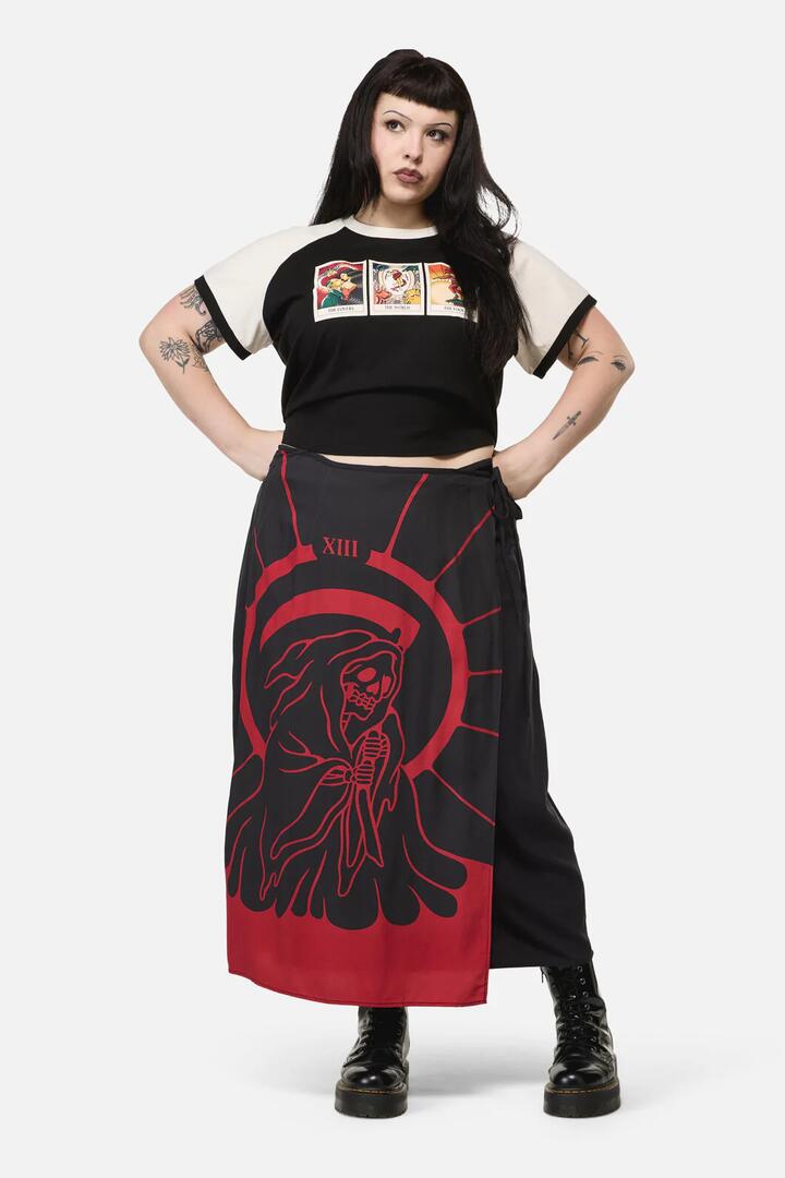 Image of a model wearing Skirts. Productname: Curve Reaper Goth Midi Wrap Skirt in Black colour by brand - Dangerfield