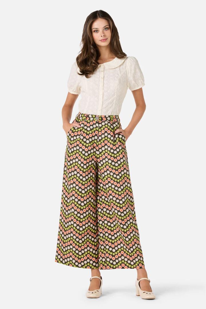 Image of a model wearing Pants. Productname: Sally Retro Pant in Green colour by brand - Princess Highway