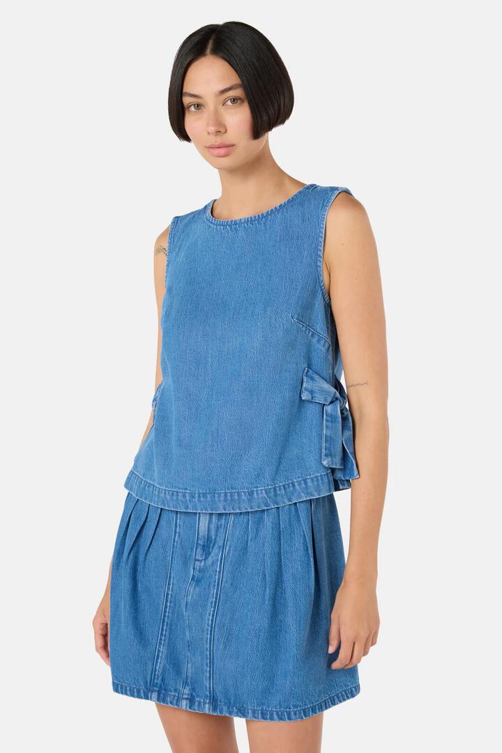 Image of a model wearing Tops. Product name - Bowtiful Denim Tank in Mid Blue colour by brand - Gorman