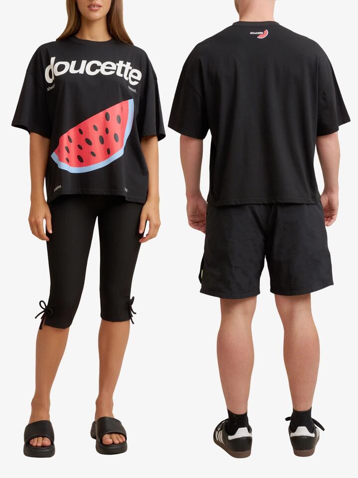 Image of a model wearing Tops. Productname: Doucette Unisex Watermelon Love Compact Tee in Black colour by brand - Doucette