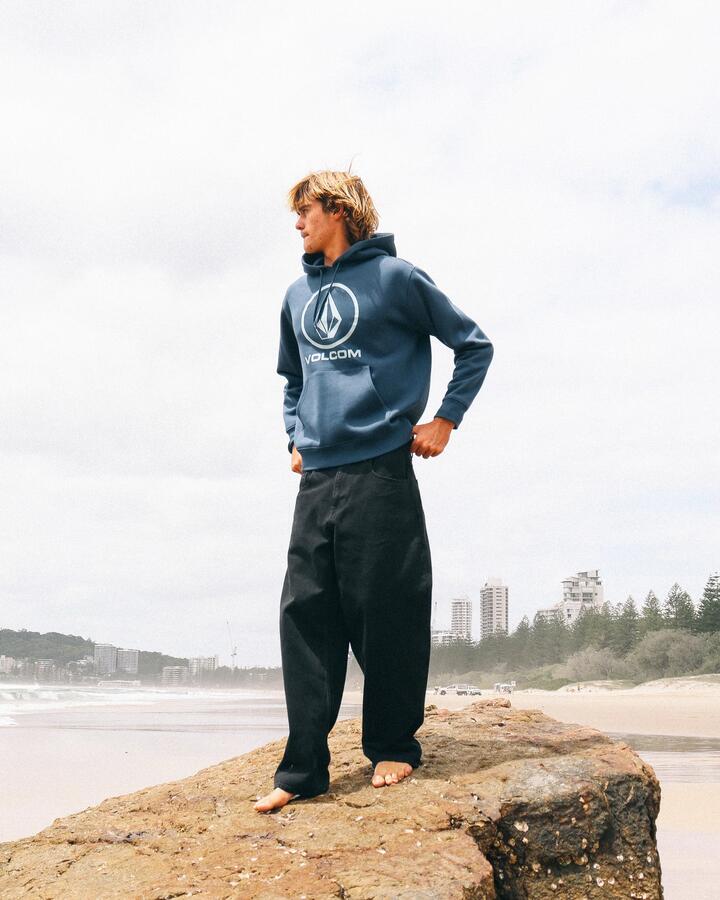 Image of a model wearing Outerwear. Product name - Volcom Mens Boulder Pullover Hoodie Baja Indigo in Baja Indigo colour by brand - Volcom