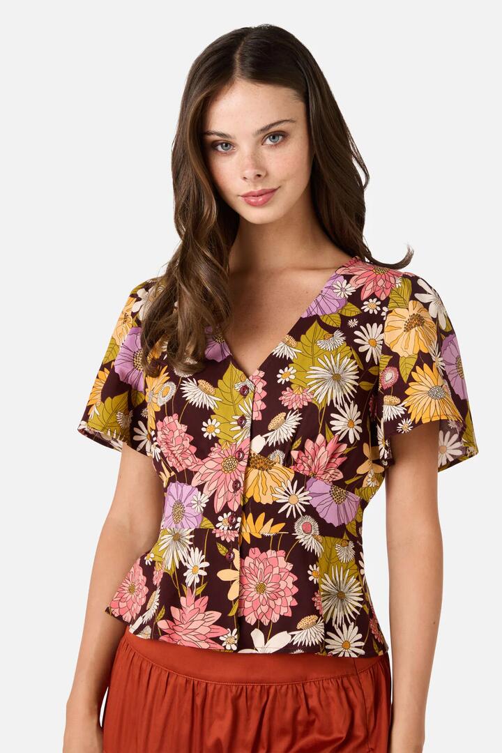 Image of a model wearing Tops. Product name - Leonie Floral Top in Plum colour by brand - Princess Highway
