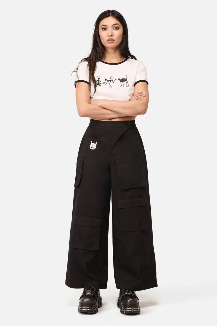 Image of a model wearing Pants. Product name - Demons Goth Cargo Pant in Black colour by brand - Dangerfield