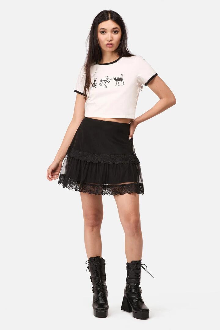 Image of a model wearing Skirts. Product name - Spiral Lace Goth Mini Skirt in Black colour by brand - Dangerfield