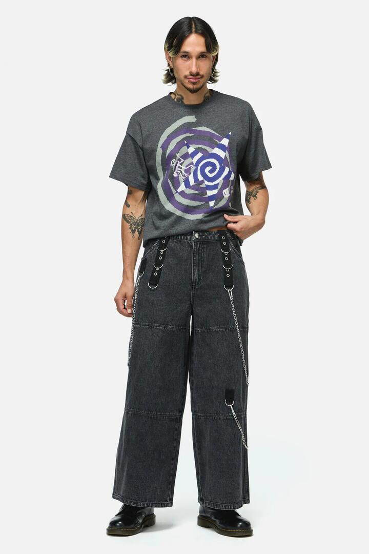 Image of a model wearing Pants. Product name - Whirl Denim Wide Leg Cargo in Black colour by brand - Dangerfield