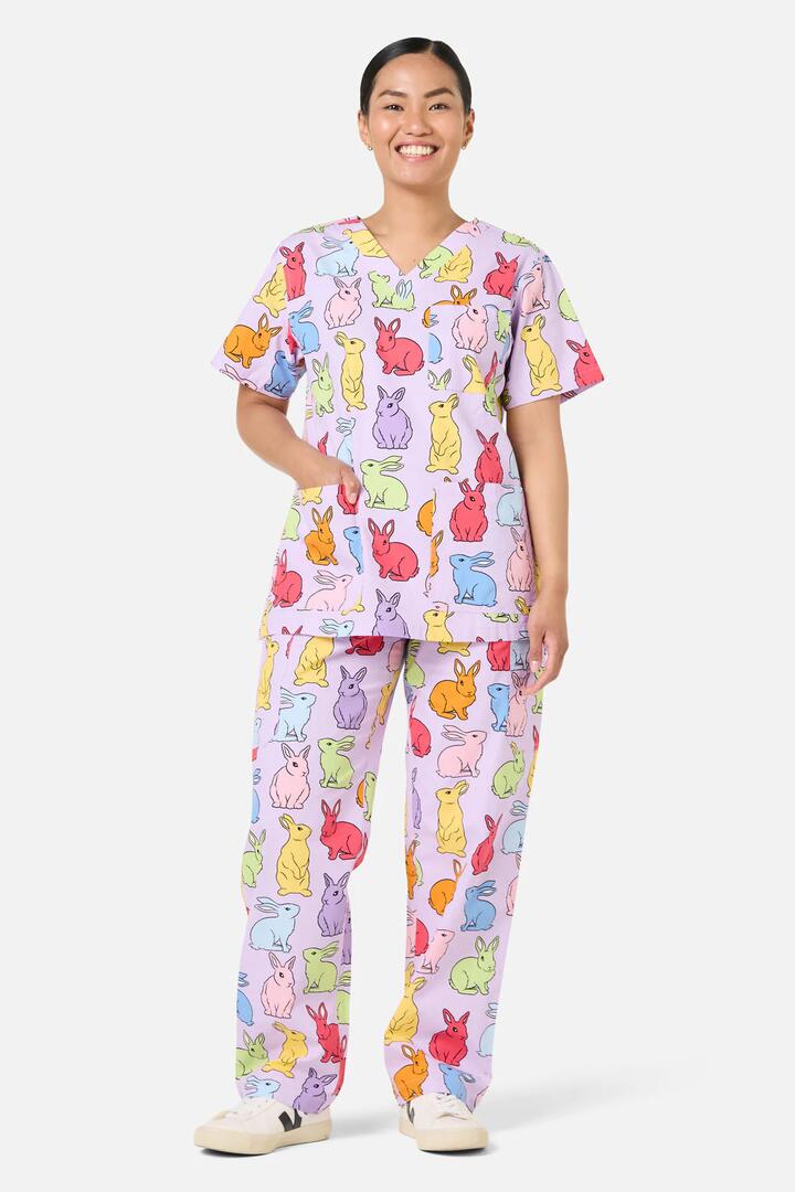Image of a model wearing Uniforms & Workwear. Product name - Rain Bunny Scrub Set in Lilac colour by brand - Scrubs With Love
