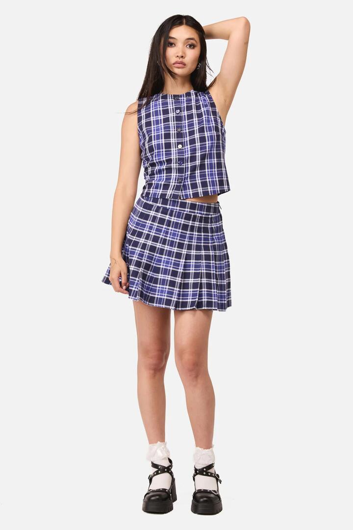 Image of a model wearing Skirts. Product name - Whirl Tartan Skort in Purple/White colour by brand - Dangerfield
