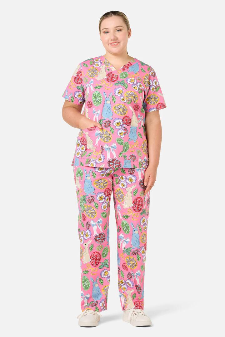 Image of a model wearing Uniforms & Workwear. Product name - Some Bunny Loves You Scrub Set in Pink colour by brand - Gorman