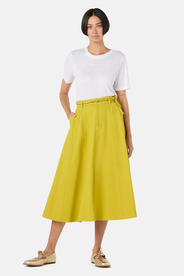 Image of a model wearing Skirts. Product name - Olive Garden Denim Skirt in Olive colour by brand - Gorman