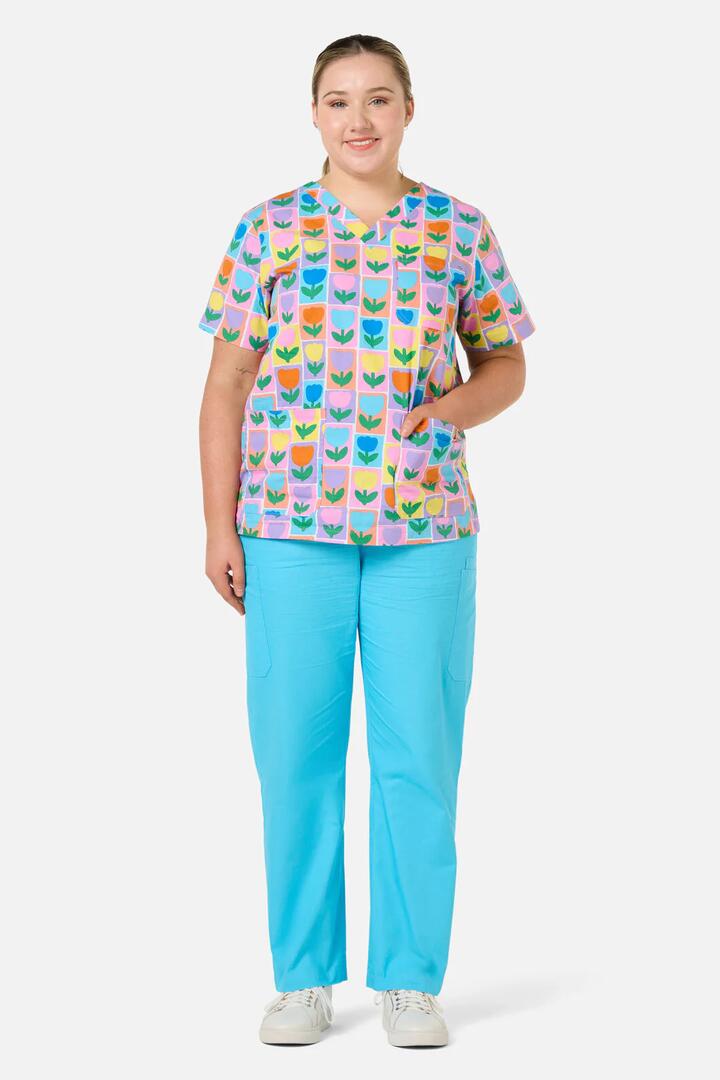 Image of a model wearing Uniforms & Workwear. Productname: Tulip Top & Pant Scrub Set in Blue colour by brand - Gorman