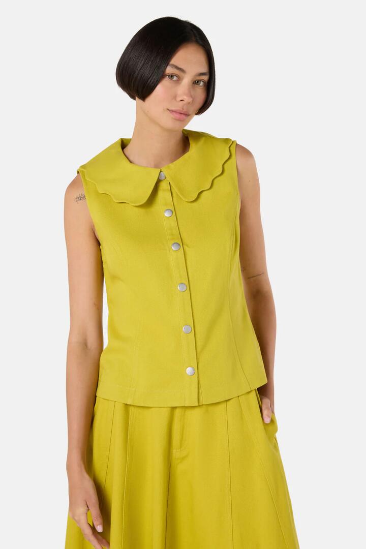 Image of a model wearing Tops. Product name - Olive Garden Denim Top in Olive colour by brand - Gorman
