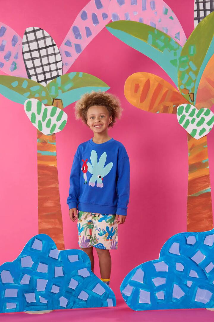 Image of a model wearing Shorts. Product name - Drivers Kids Shorts in Cream colour by brand - Gorman