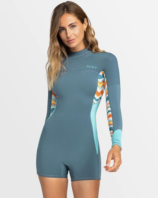 Image of a model wearing Tops. Productname: Roxy Womens 2Mm Swell Series Long Sleeve Back Zip Springsuit Starglazer - in Starglazer colour by brand - Roxy