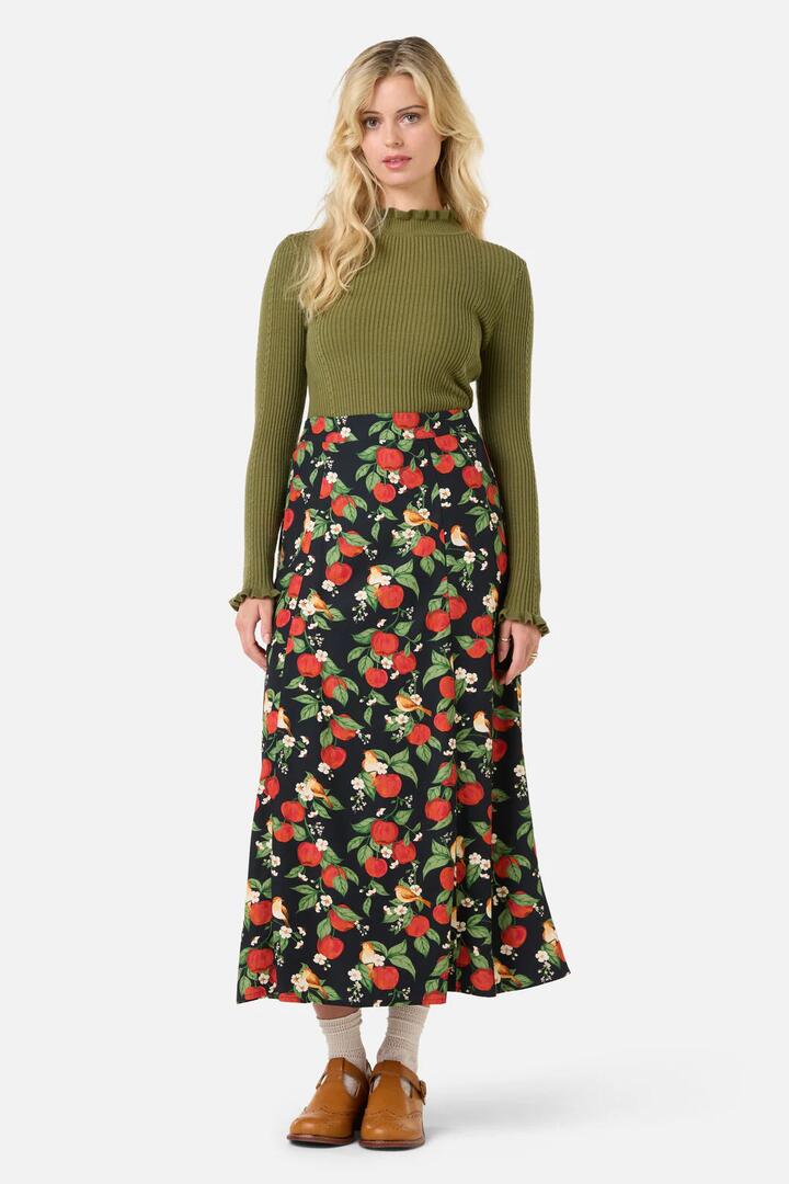 Image of a model wearing Skirts. Productname: Apple Blossom Midi Skirt in Navy colour by brand - Princess Highway