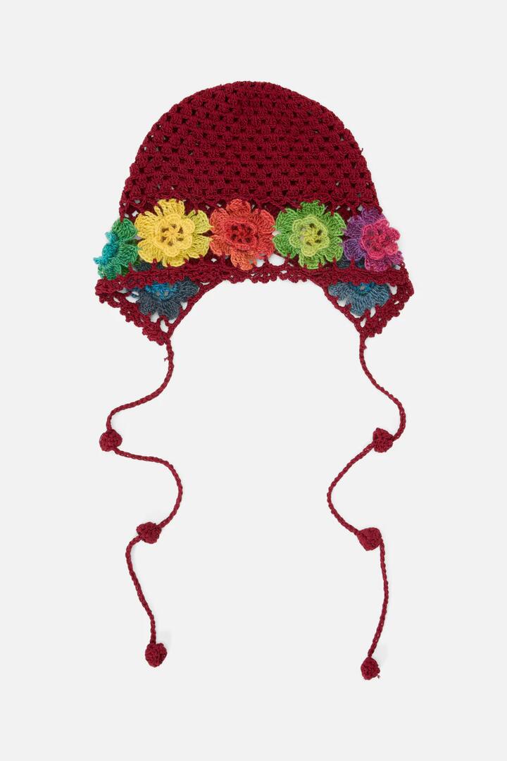 Image of a model wearing Tops. Productname: Knit Flower Bonnet in Plum colour by brand - Princess Highway