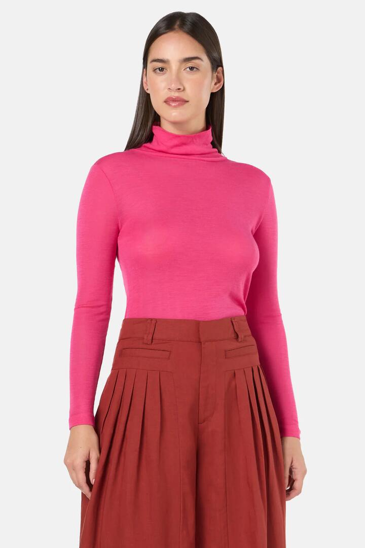 Image of a model wearing Tops. Product name - Merino Polo Top in Green colour by brand - Gorman