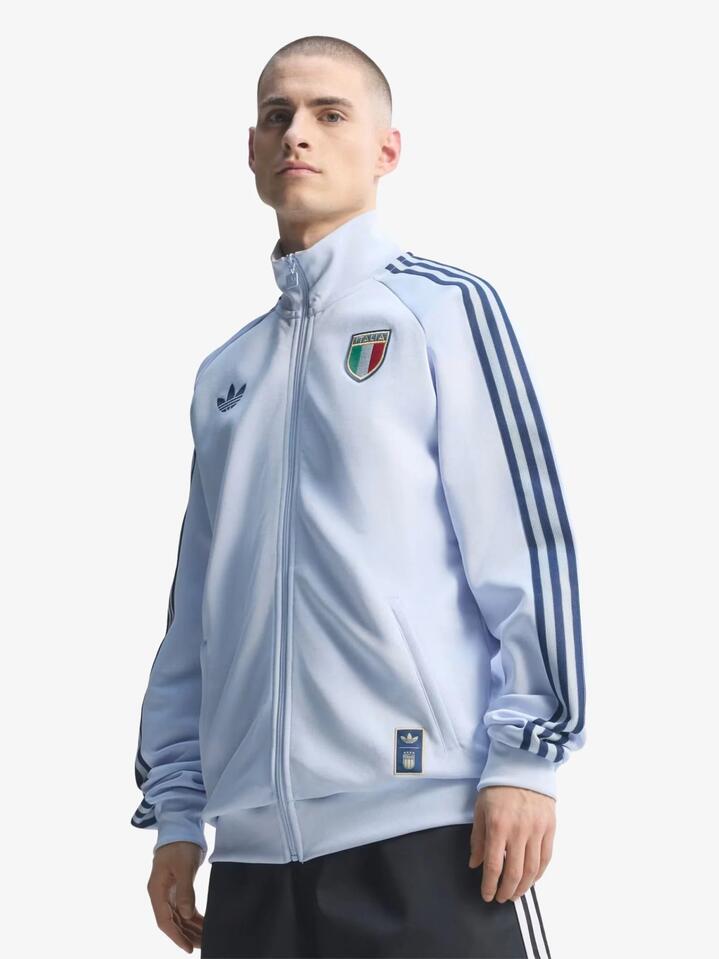 Image of a model wearing Tops. Productname: Adidas Italy Originals Track Top in Aero Blue colour by brand - Adidas