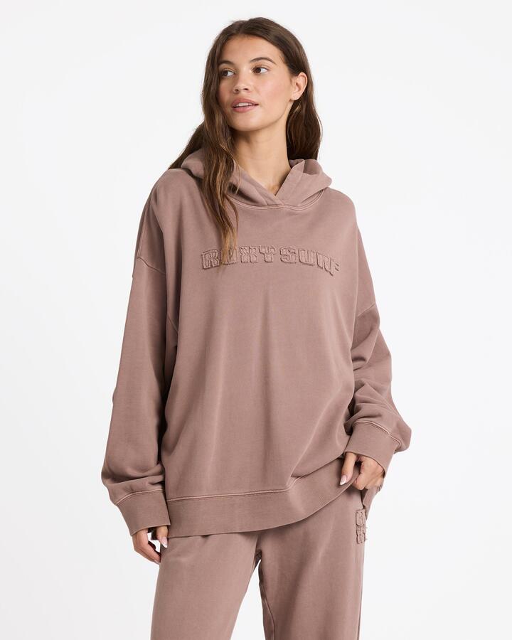 Image of a model wearing Outerwear. Productname: Roxy Womens Steppin Up Pullover Hoodie Mocha - in Mocha colour by brand - Roxy