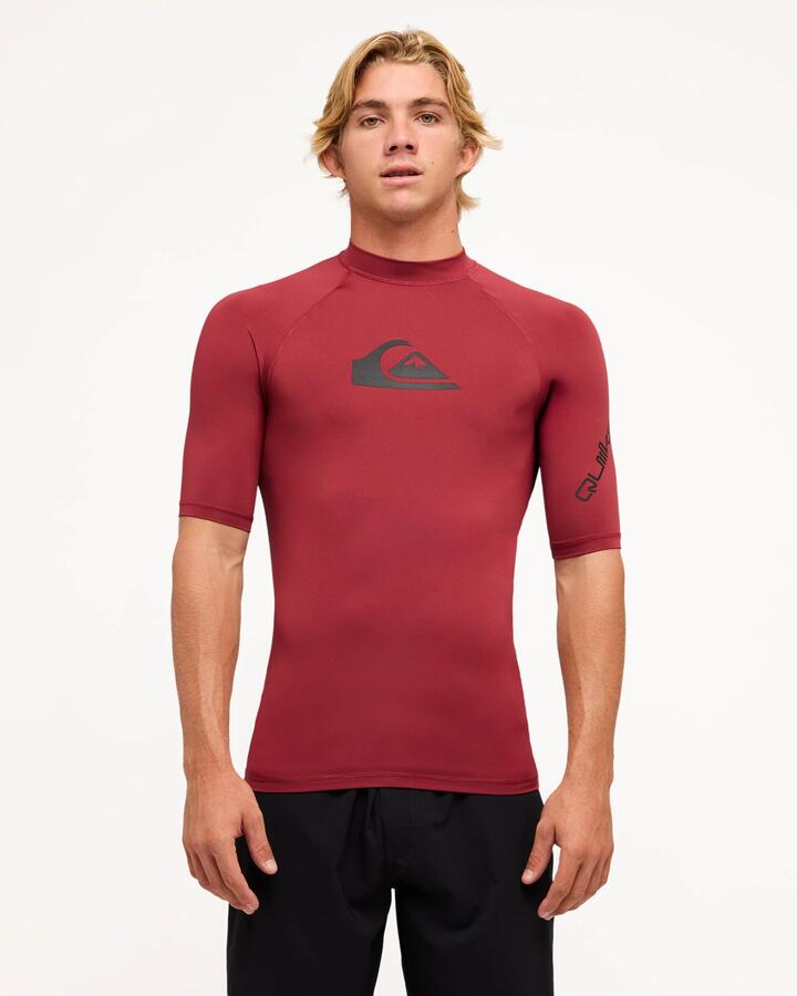Image of a model wearing Tops. Productname: Quiksilver Mens All Time Short Sleeve Rash Vest Burnt Russet - in Burnt Russet colour by brand - Quiksilver