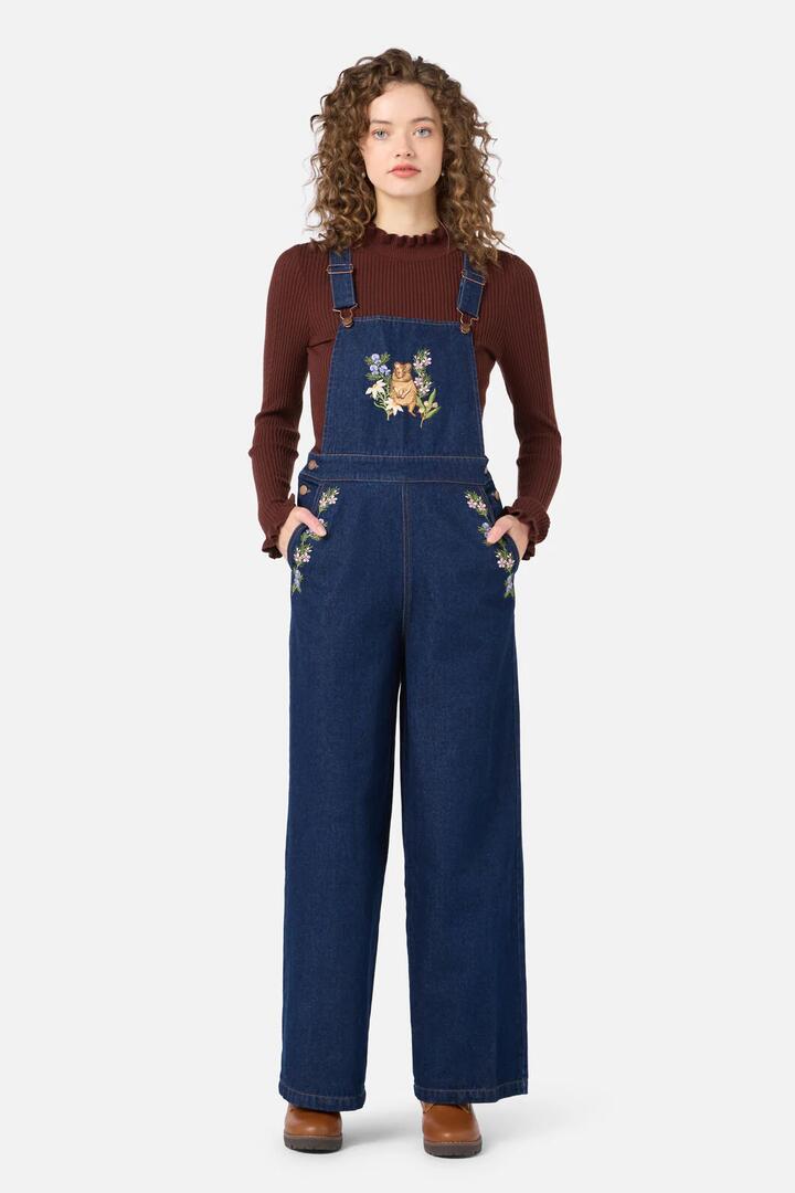 Image of a model wearing Pants. Productname: Quokka Embroidered Overall in Blue Denim colour by brand - Princess Highway