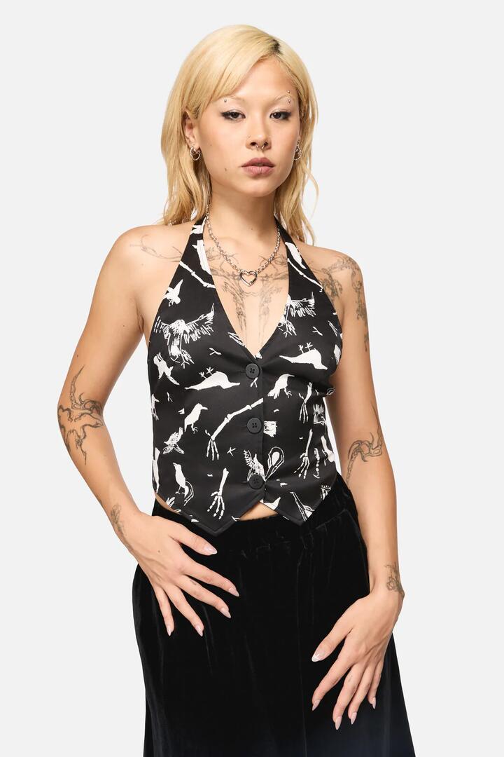 Image of a model wearing Tops. Productname: Corbeau Print Halter Neck Top in Black colour by brand - Black Friday