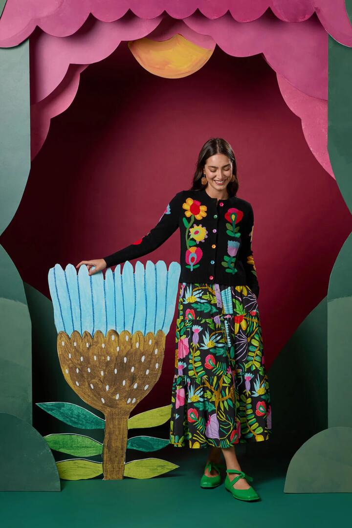Image of a model wearing Skirts. Product name - Whimsical Blooms Midi Skirt in Print colour by brand - Gorman